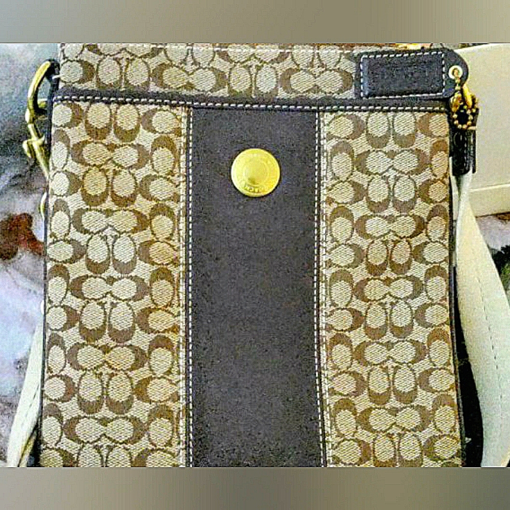 Signature C over the shoulder coach bag.